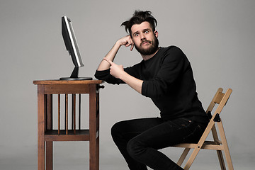 Image showing Funny and crazy man using a computer