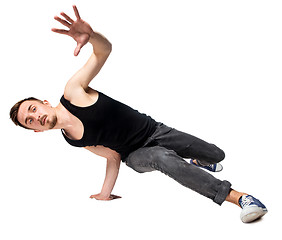 Image showing Break dancer doing one handed handstand against a white background