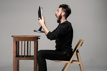 Image showing Funny and crazy man using a computer