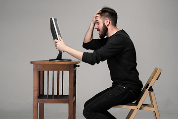 Image showing Funny and crazy man using a computer