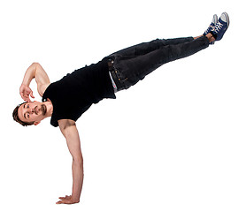 Image showing Break dancer doing one handed handstand against a white background