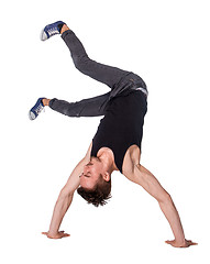 Image showing Break dancer doing handstand against  white background