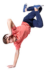 Image showing Break dancer doing one handed handstand against a white background