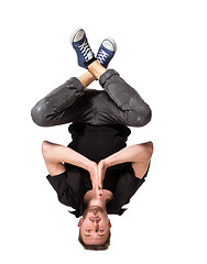 Image showing Young handsome fresh man breakdancing on white background