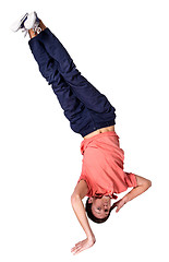 Image showing Break dancer doing one handed handstand against a white background