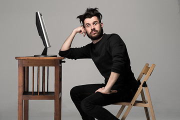 Image showing Funny and crazy man using a computer