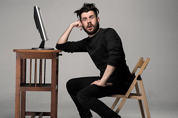 Image showing Funny and crazy man using a computer