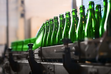 Image showing Many bottles on conveyor belt