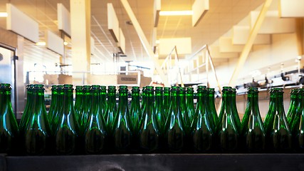 Image showing Many bottles on conveyor belt