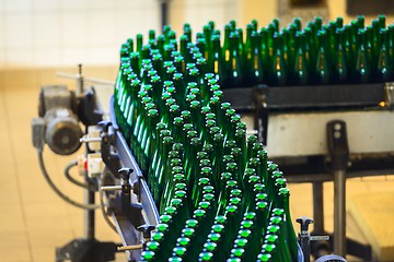 Image showing Many bottles on conveyor belt