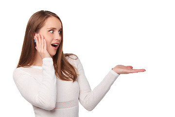 Image showing Surprised woman showing open hand palm
