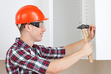Image showing worker with a hammer
