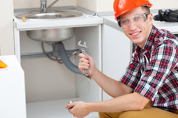 Image showing Plumber with pipe wrench