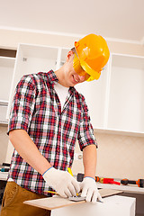 Image showing repairman making markup