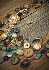 Image showing placer of vintage buttons on aged boards