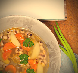 Image showing bean soup with carrots, potatoes, parsley and onions