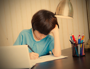 Image showing schoolboy doing homework