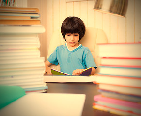 Image showing boy reading a book