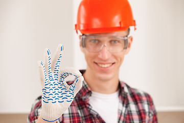 Image showing master making a perfect gesture with his gloved hand