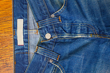 Image showing indigo jeans with a button