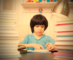 Image showing child reading a book