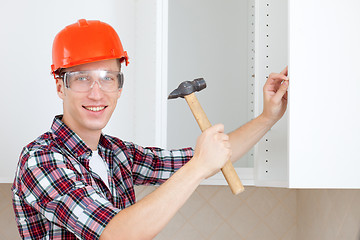 Image showing worker with a hammer