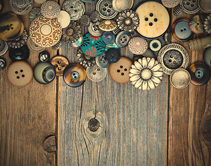 Image showing intage buttons on aged boards surface