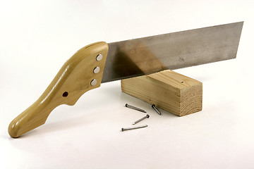 Image showing hand saw and nails