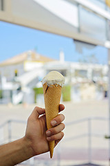 Image showing Hand holding pink ice-cream