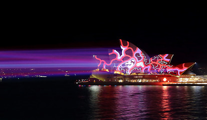Image showing Colourful red and blue light beams on Sydney Opera House