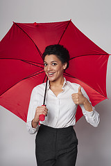 Image showing Happy woman with umbrella