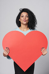 Image showing Girl holding big red heart shape