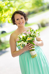 Image showing Happy bride with wedding bouquet.