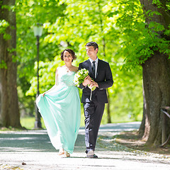 Image showing Wedding couple walking in park.