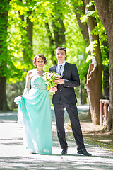 Image showing Wedding couple walking in park.