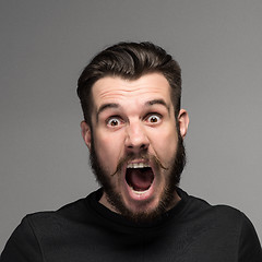 Image showing Portrait of a young surprised businessman with opened mouth