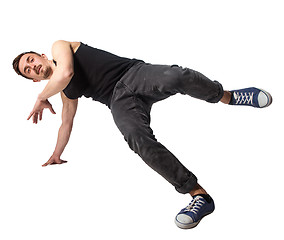 Image showing Break dancer doing one handed handstand against a white background