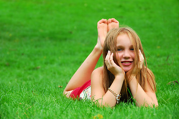 Image showing Young girl grass