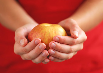 Image showing Apple in hands