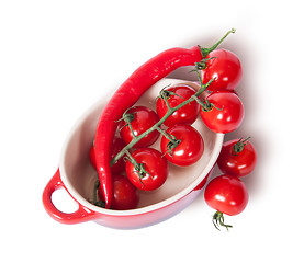 Image showing Cherry tomatoes and chili peppers in the saucepan top view