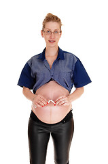 Image showing Pregnant woman breaking her cigarette.