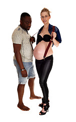 Image showing Pregnant women with suspender and black man.