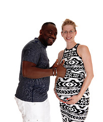 Image showing Happy white woman pregnant, black man.