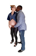Image showing Black man kissing his pregnant white woman.
