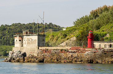 Image showing Little lighthouse on a rocky shore