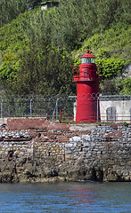 Image showing Little lighthouse on a rocky shore