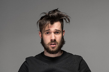 Image showing Portrait of young tousled man in studio