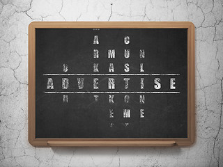 Image showing Marketing concept: word Advertise in solving Crossword Puzzle