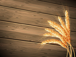 Image showing Wheat on wooden background. EPS 10 