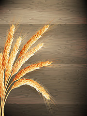 Image showing Wheat on wooden background. EPS 10 